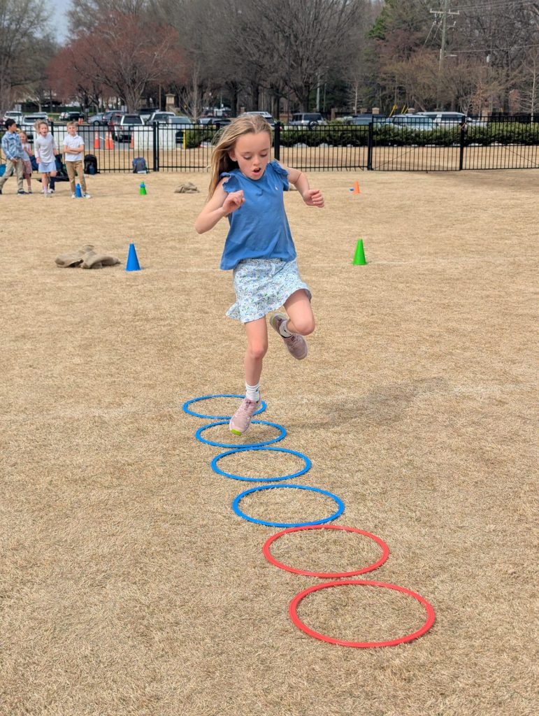Flow Motion youth Athlete hopping through hoops