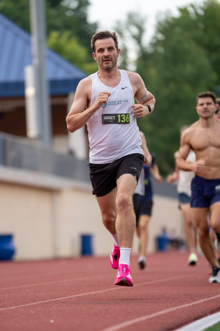 Coach Mike running on the track
